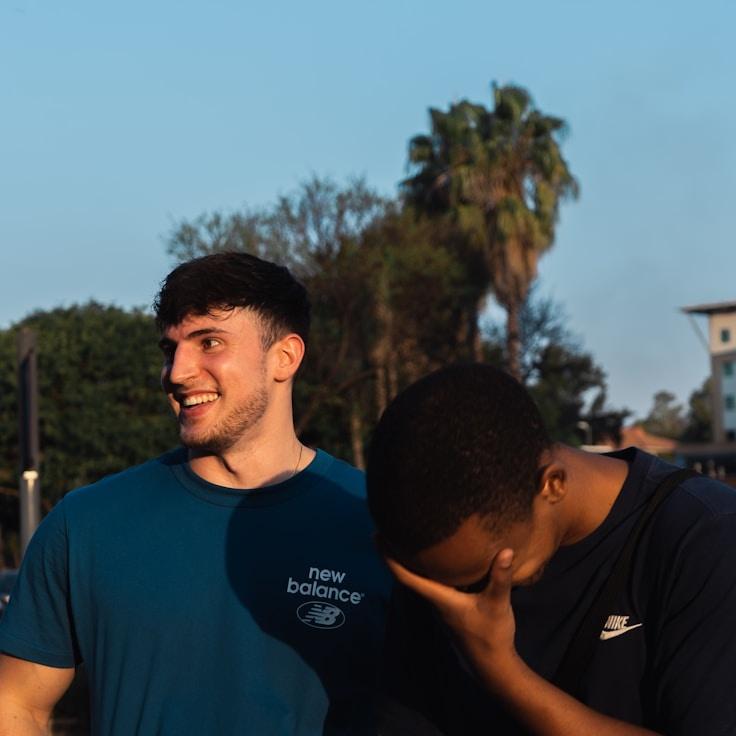 Alex Kim, Lead Design Curator at HarvestGroveSpruce, reviewing corporate floral arrangements
